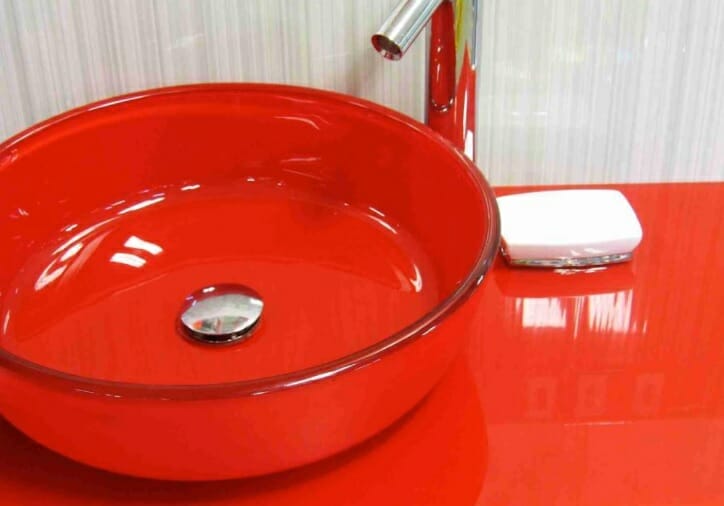 A red bathroom sink