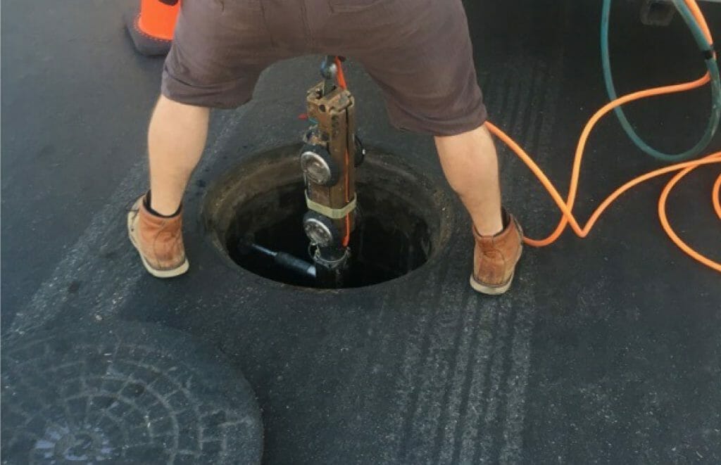 Man working on a sewer