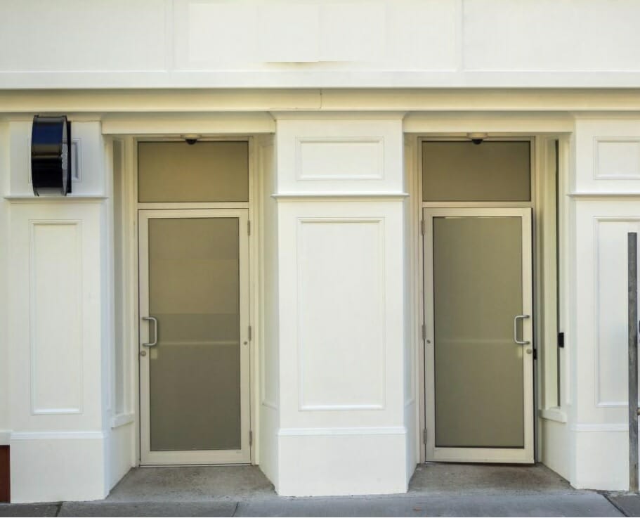 Front view of two doors outside